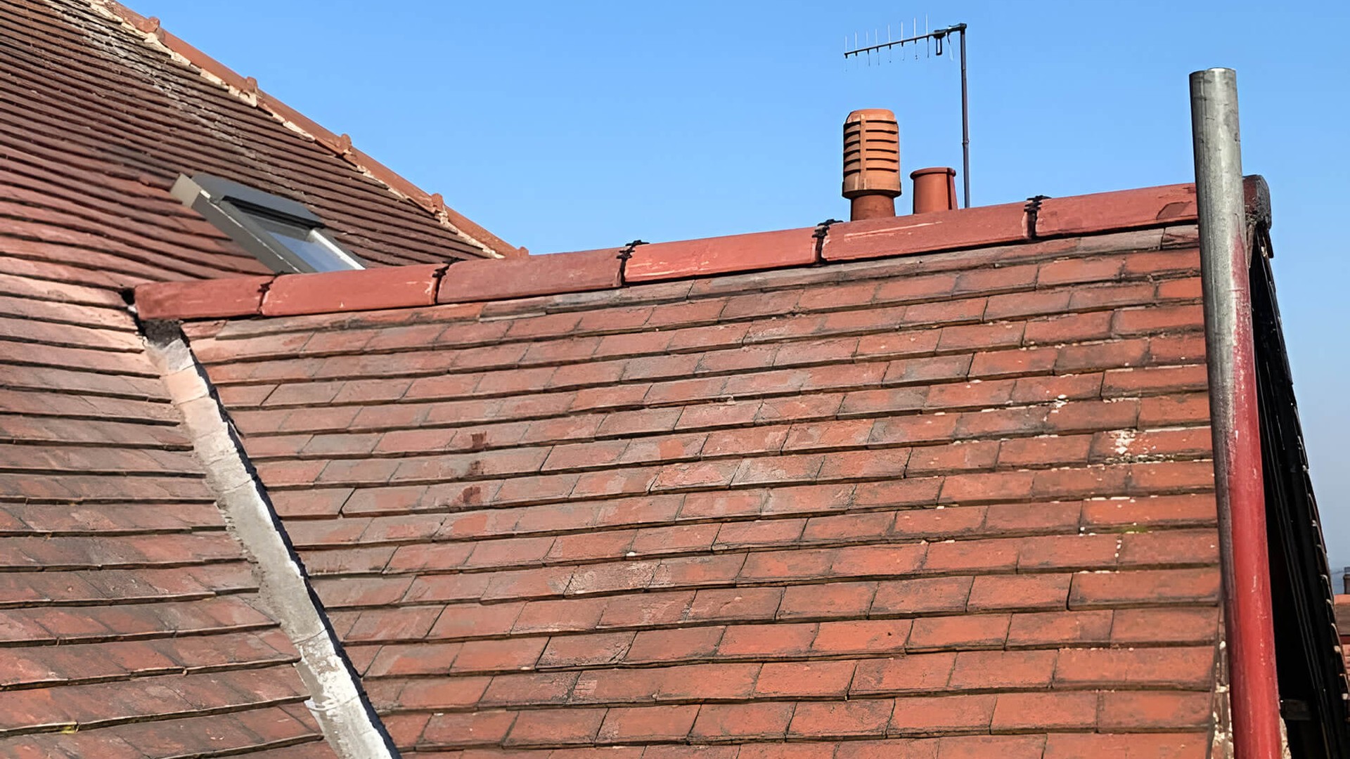 Newly pointed ridge tiles on roof
