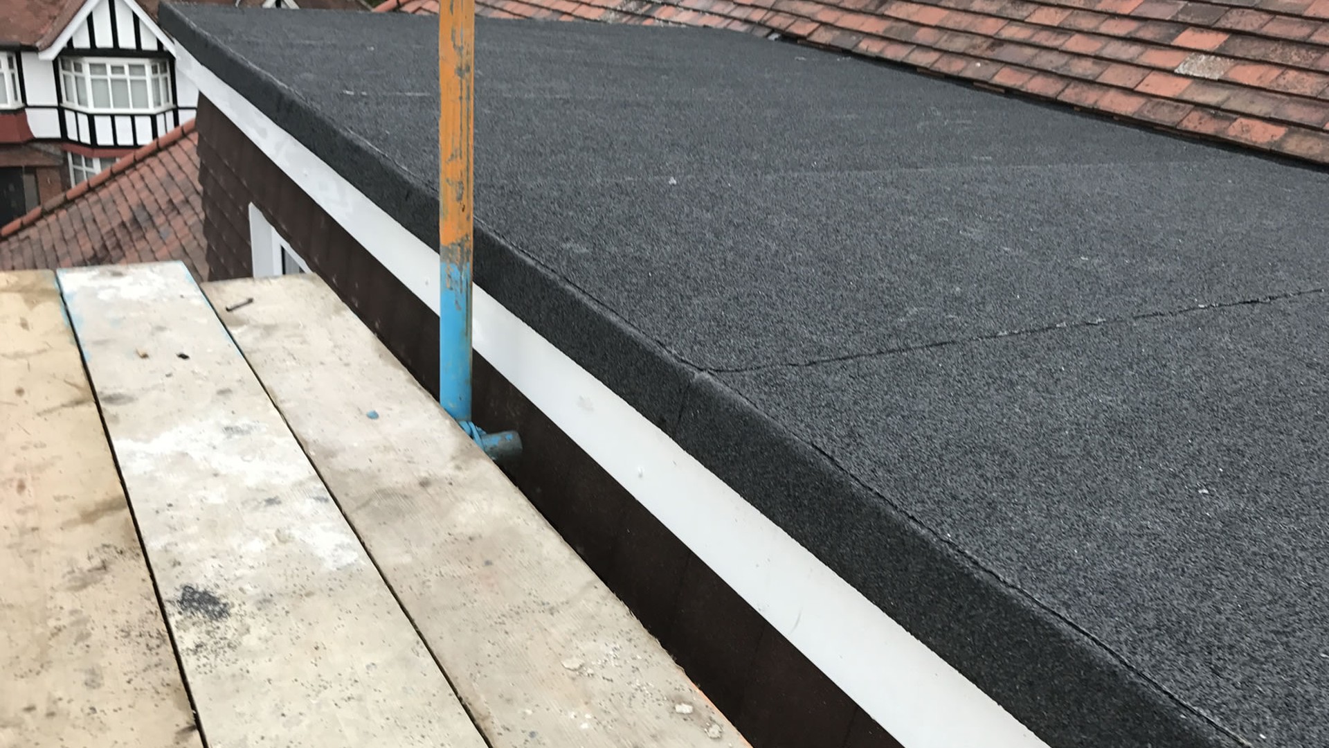 New felt flat roof installation